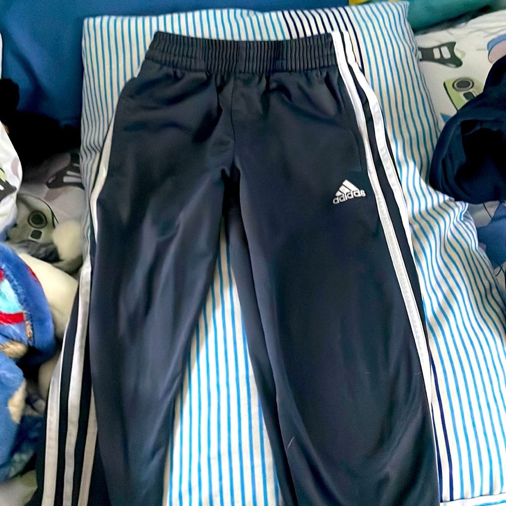 Boys grey Adidas pants.